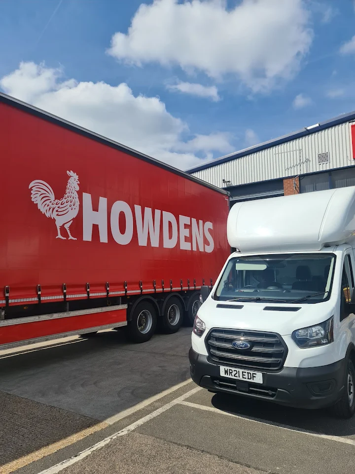 A10 Transport van beside a HOWDENS trailer at a warehouse